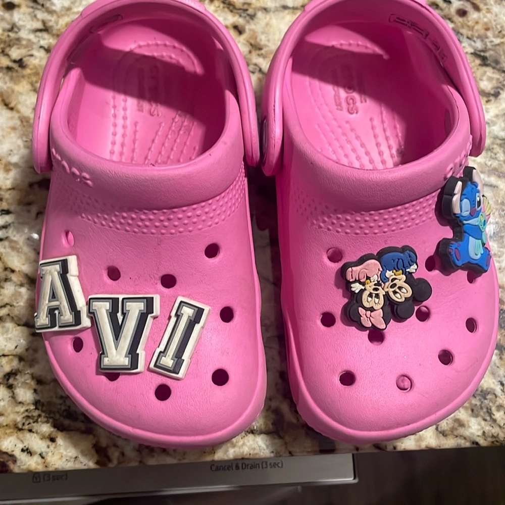 Gently used pink crocs.